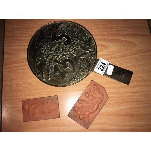 224 - A Japanese bronze hand mirror and 2 small plaques