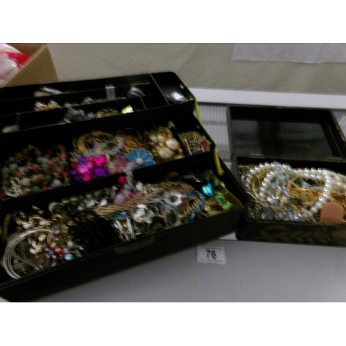 76 - A large quantity of costume jewellery in 2 boxes