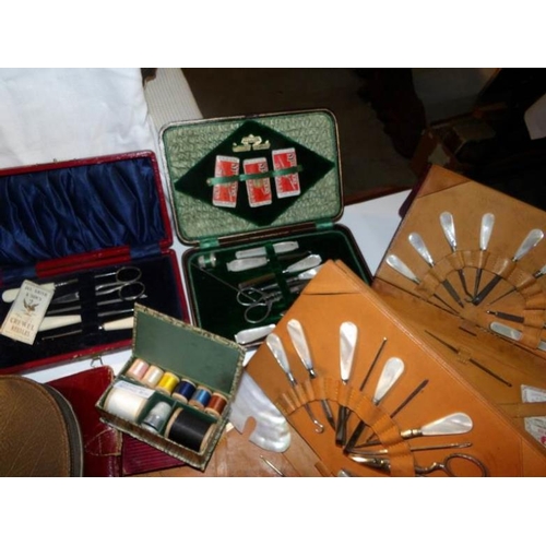 411 - A good lot of vintage cased sewing sets and other needlework items