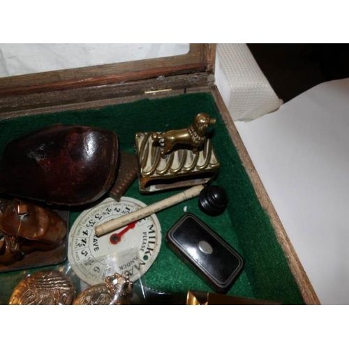 434 - A cigar box and contents including vesta's