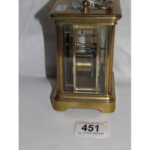 451 - A brass carriage clock, missing back door