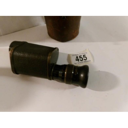 455 - A leather cased monocular