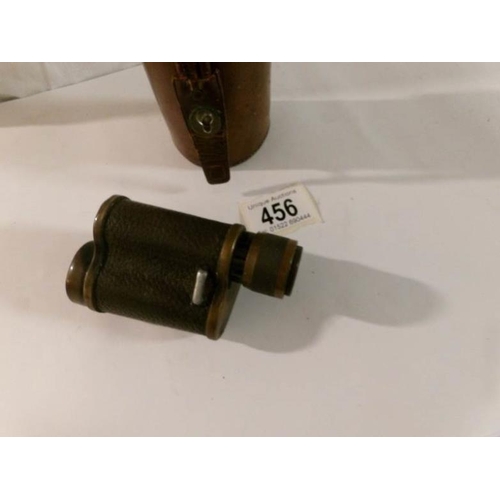 456 - A leather cased monocular