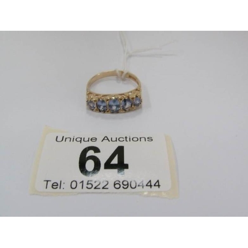 64 - A tanzanite 5 stone ring in gold, size O