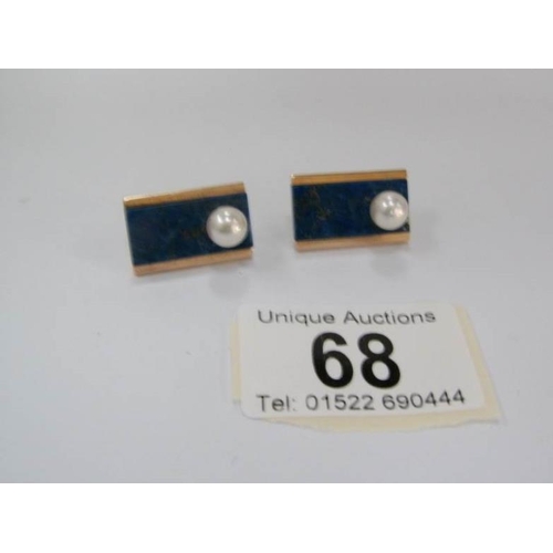 68 - A pair of art deco earrings set with lapiz lazuli and pearls in unmarked gold setting (approximate t... 