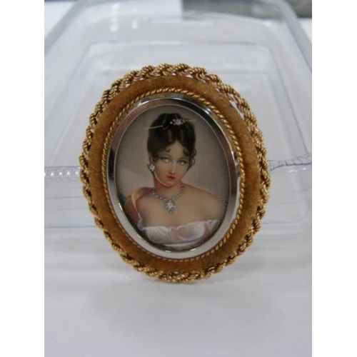 70 - A hand painted miniature profile of a young lady with diamonds in her necklace, hair and ears, in 18... 