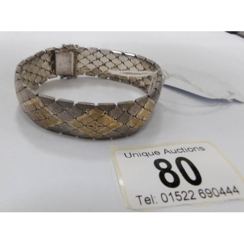 80 - A fine mesh link bracelet inlaid with gold and silver, circa 1950's