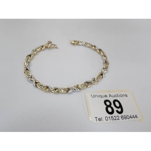 89 - A diamond set tennis bracelet in 9ct gold, 10.8g with approximately 1/3 ct diamond weight