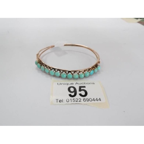 95 - A 14ct gold and turquoise bangle