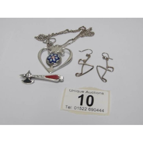 10 - A silver pendant with millefiori inset, a silver axe brooch and a pair of silver earrings