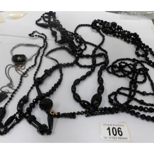 106 - 8 Whitby jet necklaces, a bracelet and a brooch