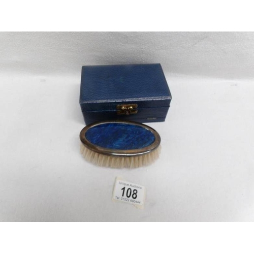 108 - A gentleman's silver dressing brush in case