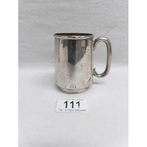 111 - A silver christening mug with engraving, H M London 1920, approximately 116g