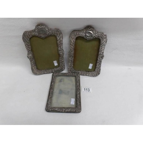 113 - A pair of silver photo frames and one other