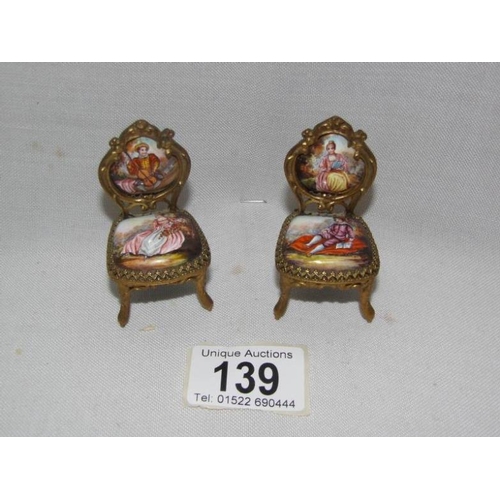 139 - A collection of 19th century Austrian hand painted music boxes and other items including a grand pia... 