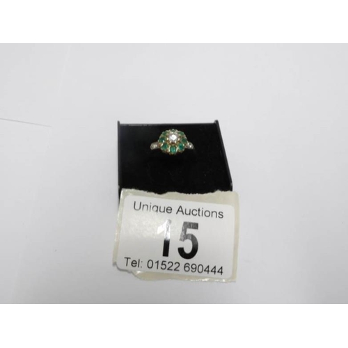 15 - An 18ct yellow gold diamond and emerald ring, size P