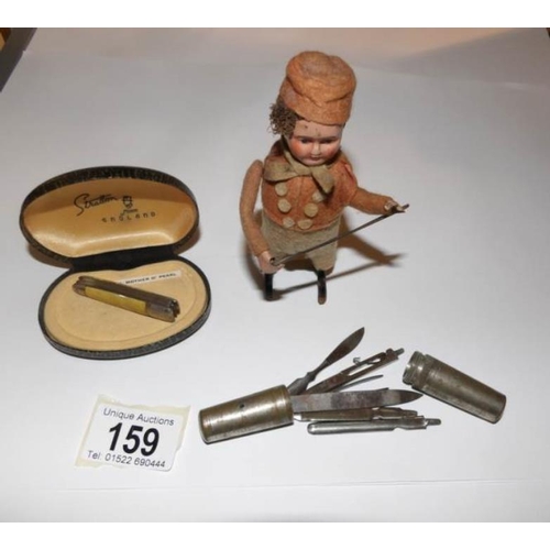 159 - A clockwork violin player, a mother of pearl penknife and a pocket manicure set