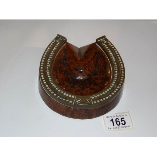 165 - An unusual oak and brass horse shoe shaped crib board