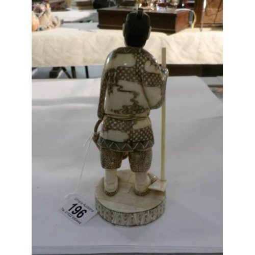 196 - A 19th century carved ivory Chinese figure, signed (some age cracks)