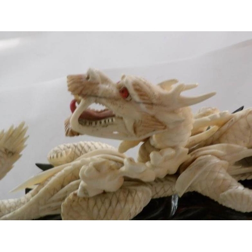 198 - A 19th century carved ivory dragon, signed