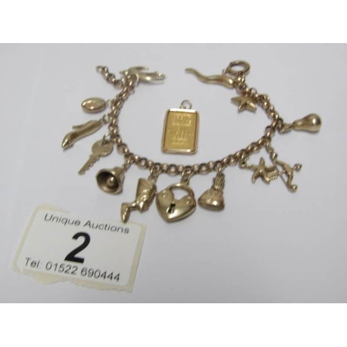 2 - A gold charm bracelet and a 5g gold ingot

Ingot marked as fine gold 999.9
Bracelet 15gms, marked 37... 