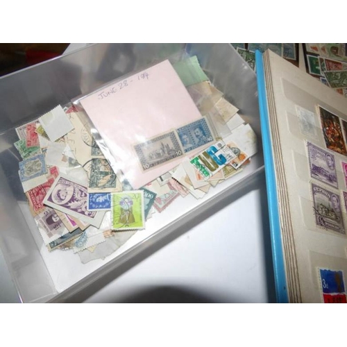 221 - Several sheets of world stamps, a stamp album and a box of stamps