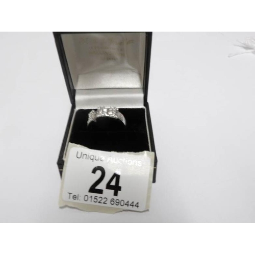 24 - An 18ct white gold 82pt diamond baguette and brilliants ring, size M