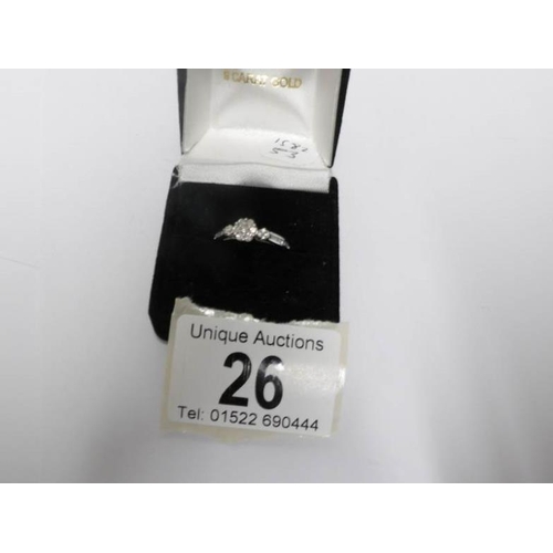 26 - An 18ct white floral top and side shanked diamond ring, size L