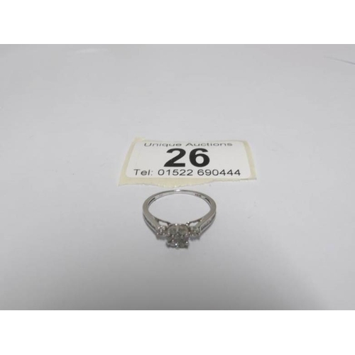 26 - An 18ct white floral top and side shanked diamond ring, size L