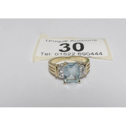 30 - An 18ct yellow gold aqua and diamond ring, size L