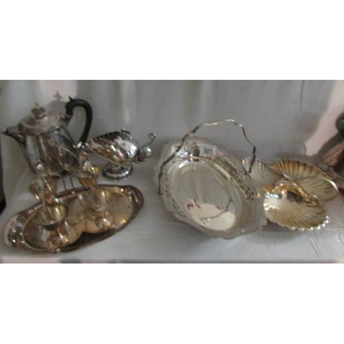 301 - A mixed lot of silver plate including egg cup stand, basket, shell dish etc