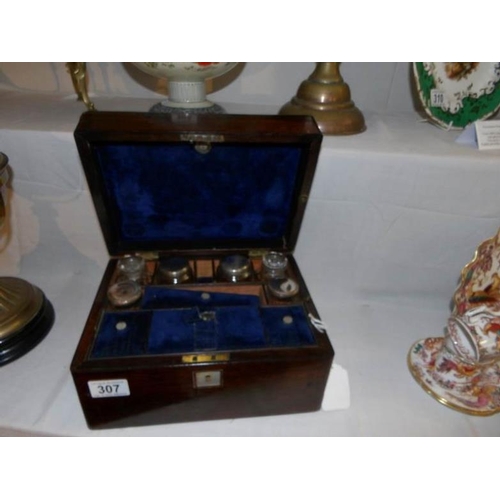 307 - A Victorian rosewood vanity box with contents