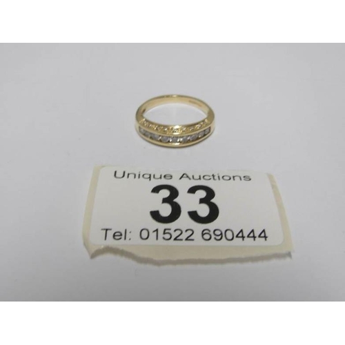 33 - An 18ct gold ring set 9 diamonds, size M