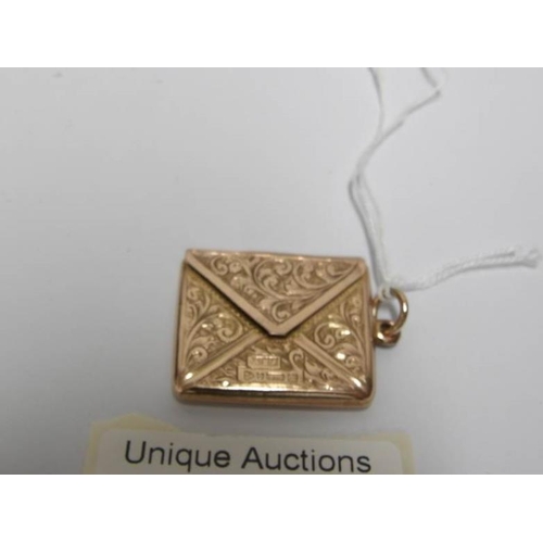 34 - A 9ct gold stamp case shaped as an envelope, H M Chester 1923