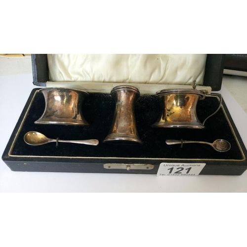 121 - A cased silver condiment set