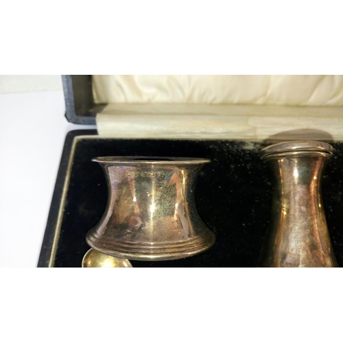 121 - A cased silver condiment set