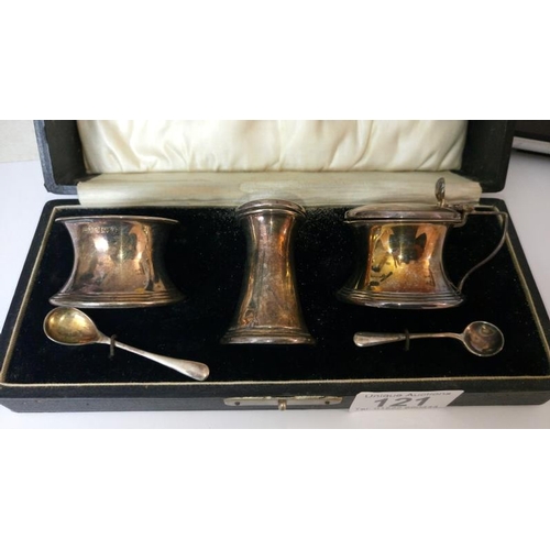 121 - A cased silver condiment set