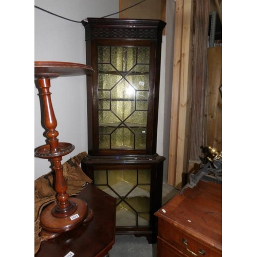 1032 - A corner cabinet with astragal glazed doors