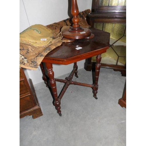 1034 - A mahogany octagonal table