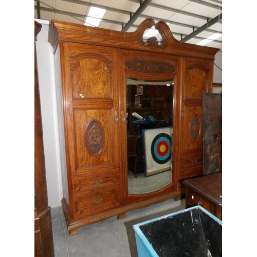 1039 - A 19th century satin wood wardrobe