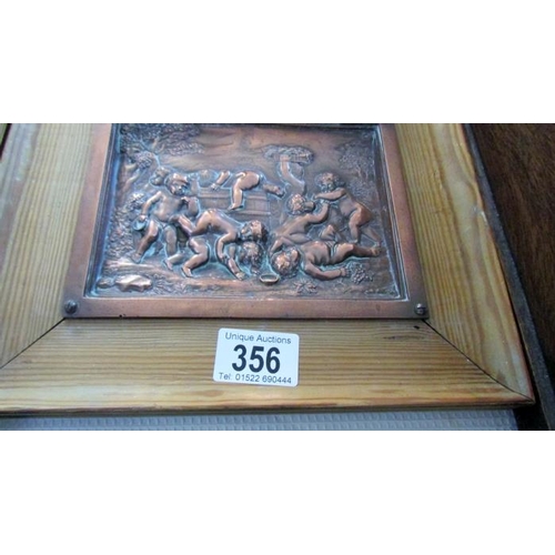 356 - A pair of copper cherub plaques in pine frames