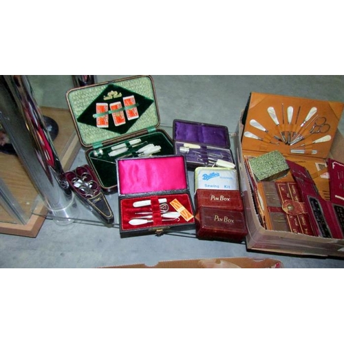 411 - A good lot of vintage cased sewing sets and other needlework items