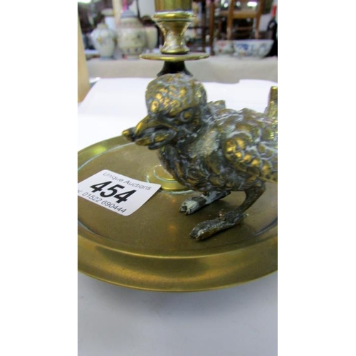 454 - A glass specimen flute on brass base surmounted with bird figure