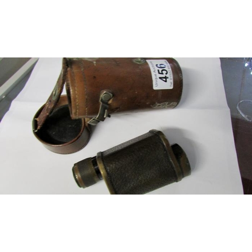 456 - A leather cased monocular