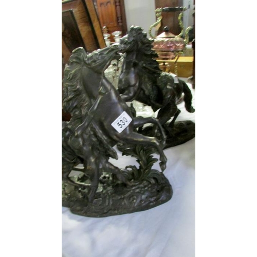 530 - A pair of signed bronze Marley horses