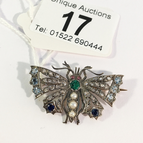 17 - A diamond, emerald, pearl and sapphire set butterfly brooch