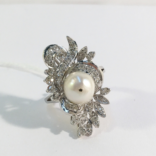 19 - A high carat white gold floral diamond ring with central pearl, size J