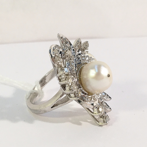 19 - A high carat white gold floral diamond ring with central pearl, size J