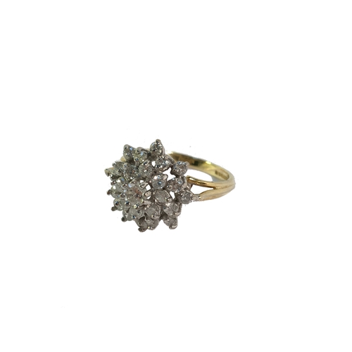 28 - An 18ct yellow gold floral diamond ring of approximately 1ct, size M