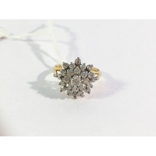 28 - An 18ct yellow gold floral diamond ring of approximately 1ct, size M